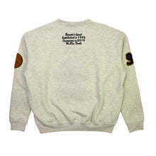 Load image into Gallery viewer, Buy Toronto Raptors Varsity Unisex Oversized Crewneck by Mitchell & Ness - Oatmeal